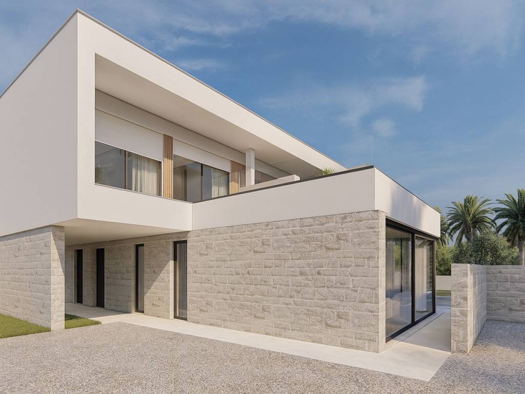 Warm stone facade with elegant terrace