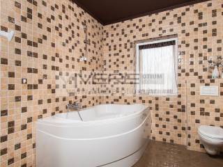Bathroom with corner bathtub